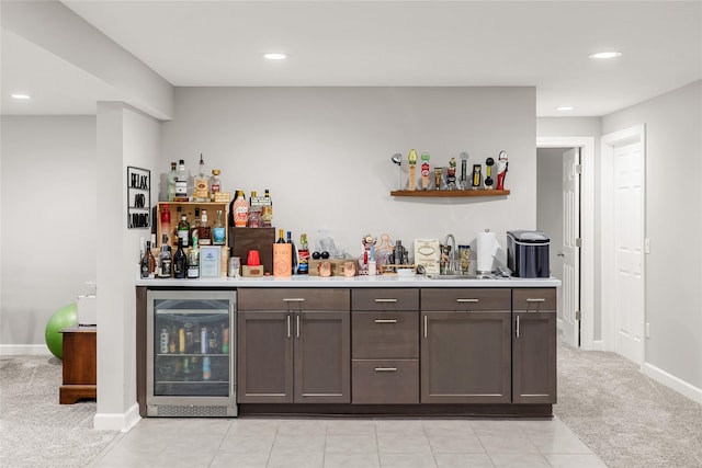 2320 SE Maxwell Dr, Waukee, IA 50263 - indoor wet bar with wine cooler, light colored carpet, recessed lighting, and baseboards