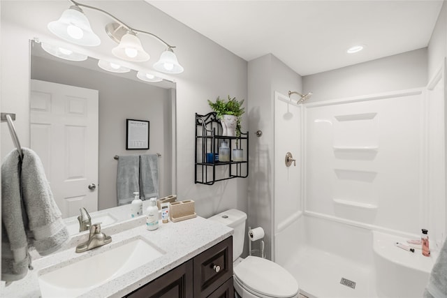 2320 SE Maxwell Dr, Waukee, IA 50263 - full bathroom featuring vanity, a shower, and toilet