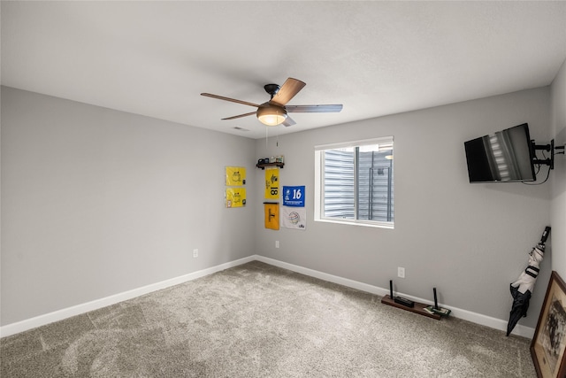 2320 SE Maxwell Dr, Waukee, IA 50263 - spare room featuring ceiling fan, carpet floors, and baseboards