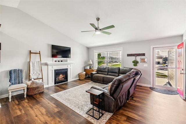 2320 SE Maxwell Dr, Waukee, IA 50263 - living room with vaulted ceiling, ceiling fan, wood finished floors, a lit fireplace, and baseboards