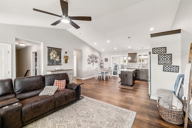 2320 SE Maxwell Dr, Waukee, IA 50263 - living room with vaulted ceiling, ceiling fan, dark wood-type flooring, baseboards, and recessed lighting