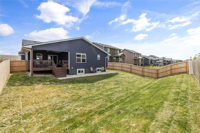2320 SE Maxwell Dr, Waukee, IA 50263 - rear view of property featuring a wooden deck, a patio, and a residential view