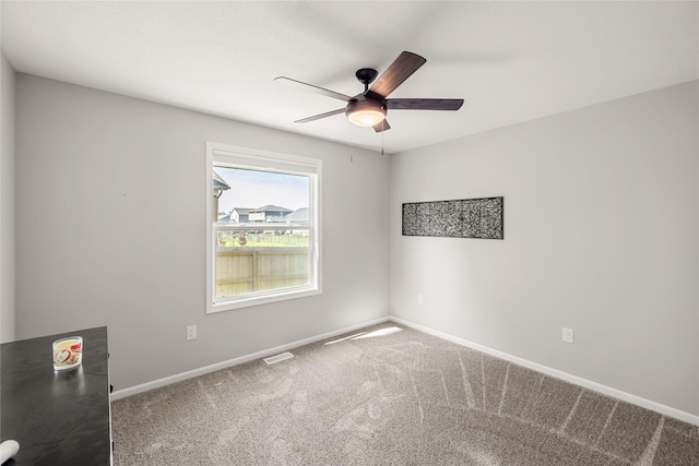 2320 SE Maxwell Dr, Waukee, IA 50263 - carpeted empty room with a ceiling fan and baseboards