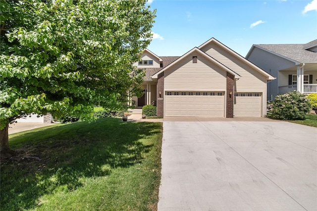 6814 Aubrey Ct, Johnston, IA 50131 - view of front of home with a garage, brick siding, concrete driveway, a front yard, and roof with shingles