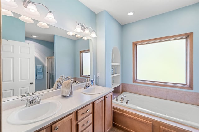 6814 Aubrey Ct, Johnston, IA 50131 - full bathroom with a garden tub, double vanity, and a stall shower