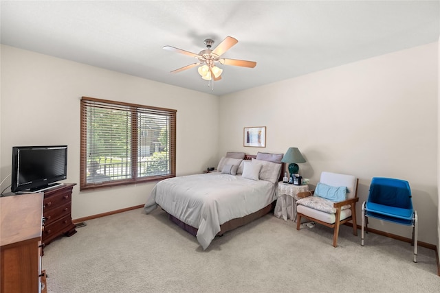 6814 Aubrey Ct, Johnston, IA 50131 - bedroom with baseboards, light carpet, and a ceiling fan