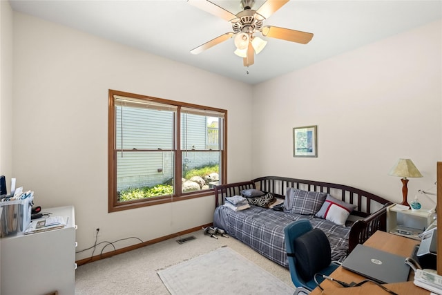 6814 Aubrey Ct, Johnston, IA 50131 - carpeted bedroom with baseboards and a ceiling fan