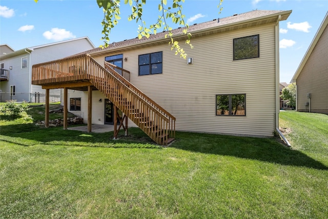 6814 Aubrey Ct, Johnston, IA 50131 - rear view of house with a wooden deck, a yard, stairs, and a patio