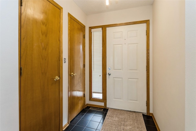 4400 Ep True Pkwy Unit 4, West Des Moines, IA 50265 - entrance foyer featuring dark tile patterned floors and baseboards