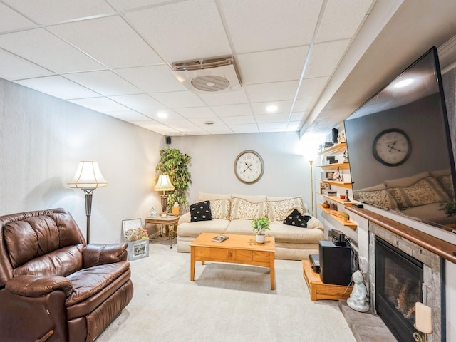 812 W 2nd St S, Newton, IA 50208 - carpeted living room featuring a drop ceiling, a fireplace, and recessed lighting