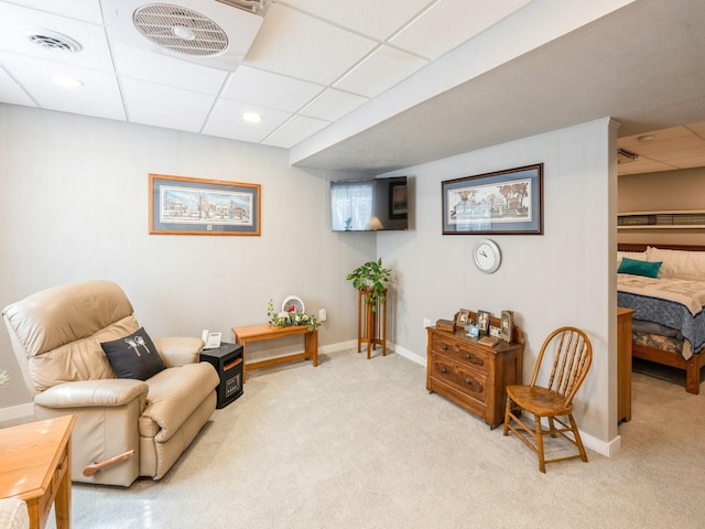 812 W 2nd St S, Newton, IA 50208 - living area with carpet flooring, a drop ceiling, and baseboards