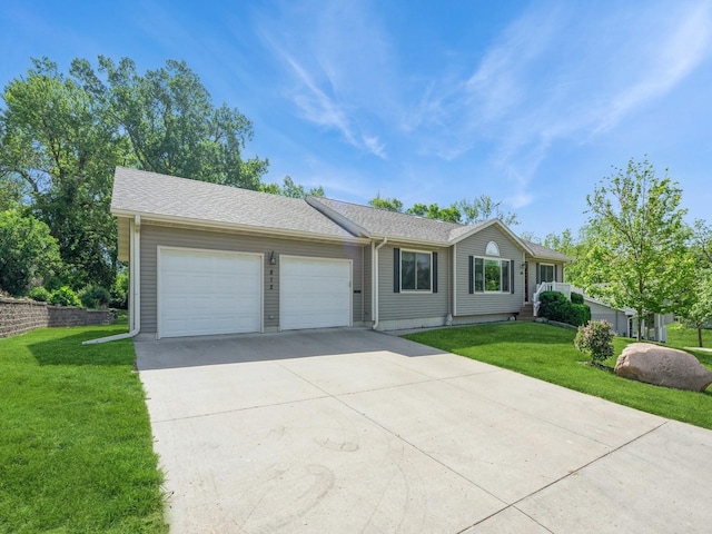 812 W 2nd St S, Newton, IA 50208 - ranch-style house with a garage, concrete driveway, and a front yard