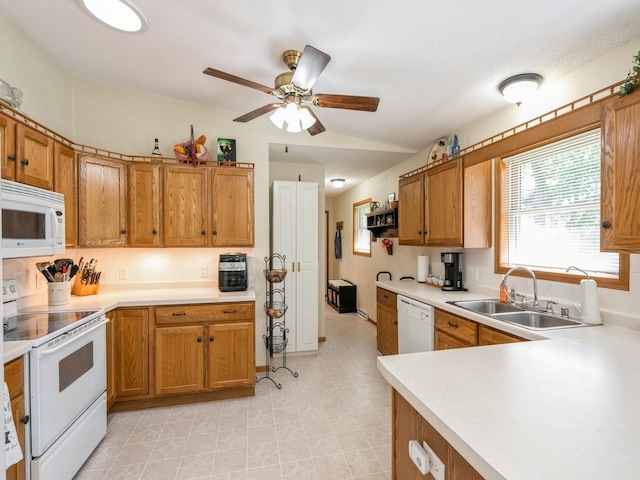 812 W 2nd St S, Newton, IA 50208 - kitchen featuring white appliances, a sink, a ceiling fan, and light countertops