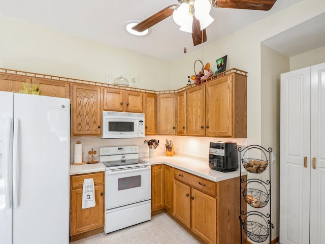 812 W 2nd St S, Newton, IA 50208 - kitchen featuring white appliances, light countertops, ceiling fan, and brown cabinetry