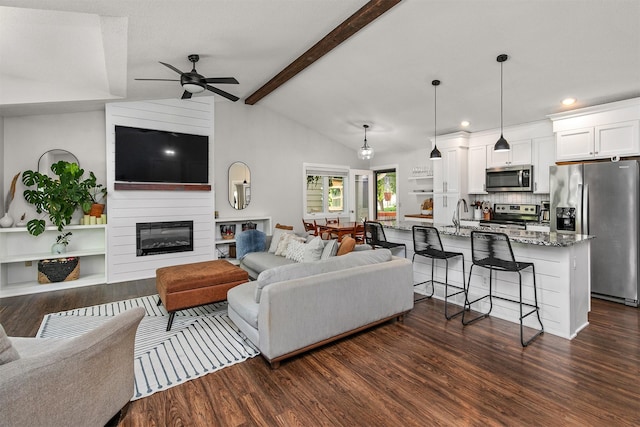 4670 Meadow Valley Dr, West Des Moines, IA 50265 - living area with ceiling fan, dark wood finished floors, recessed lighting, and a fireplace