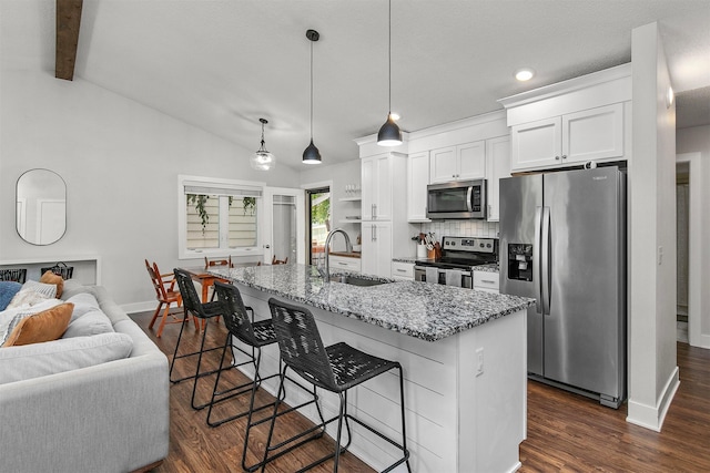4670 Meadow Valley Dr, West Des Moines, IA 50265 - kitchen with stainless steel appliances, a sink, baseboards, white cabinets, and recessed lighting