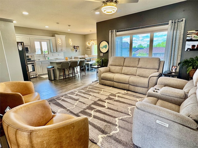 1008 Pine Brooke Ct, Clear Lake, IA 50428 - living room with ceiling fan, wood finished floors, and recessed lighting