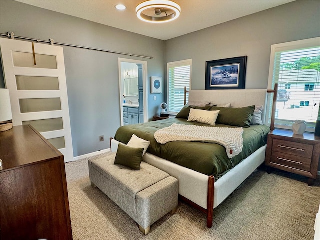 1008 Pine Brooke Ct, Clear Lake, IA 50428 - bedroom featuring carpet flooring, multiple windows, ensuite bathroom, and recessed lighting