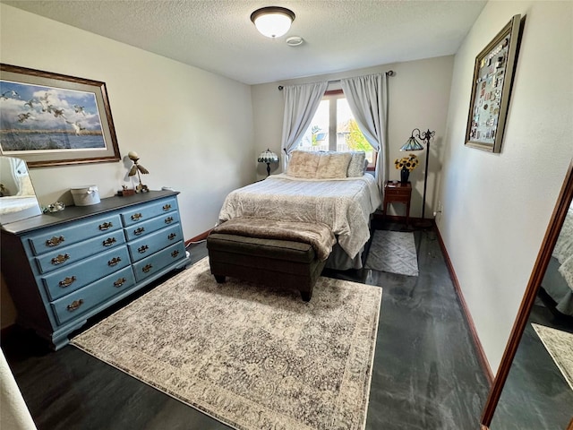 1008 Pine Brooke Ct, Clear Lake, IA 50428 - bedroom with a textured ceiling, dark wood-style flooring, and baseboards