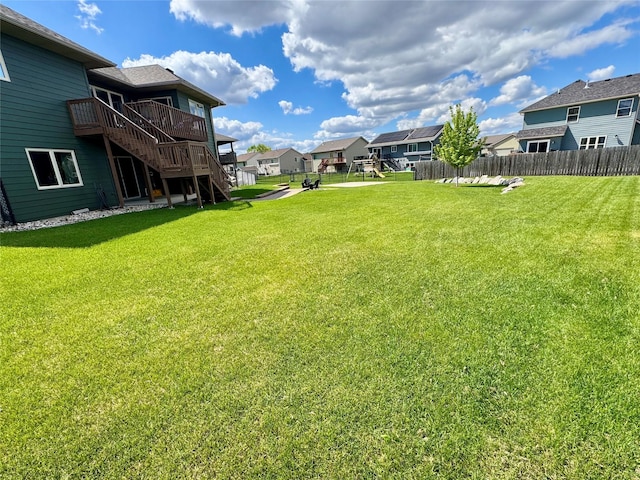 1008 Pine Brooke Ct, Clear Lake, IA 50428 - view of yard featuring stairs, a residential view, and a deck