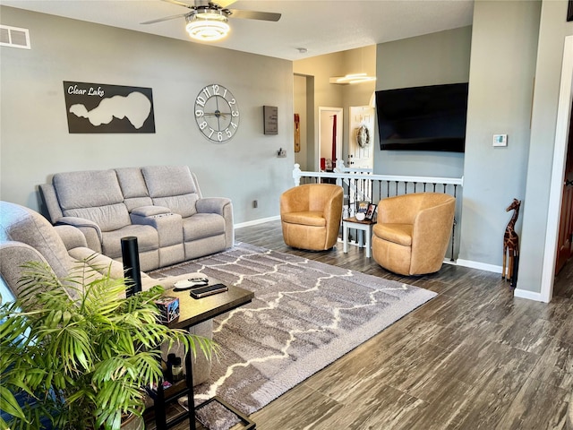 1008 Pine Brooke Ct, Clear Lake, IA 50428 - living room featuring ceiling fan, baseboards, and wood finished floors