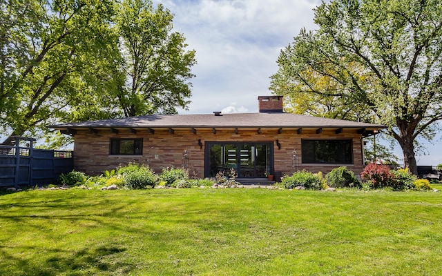 201 Jet St SW, Mitchellville, IA 50169 - back of house featuring a chimney