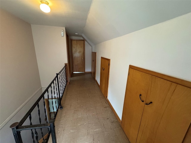 1300 Shawnee Ave, Des Moines, IA 50313 - corridor featuring light flooring, lofted ceiling, and baseboards