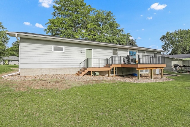 216 E 9th St, Pella, IA 50219 - rear view of house featuring a wooden deck and a lawn