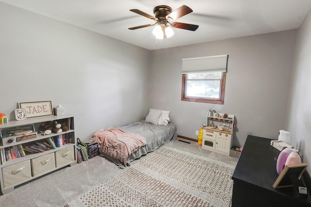 216 E 9th St, Pella, IA 50219 - bedroom featuring carpet and a ceiling fan