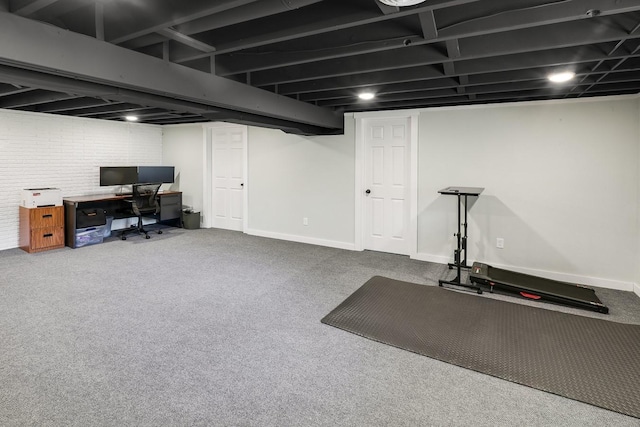 216 E 9th St, Pella, IA 50219 - finished basement featuring an office area, baseboards, and carpet