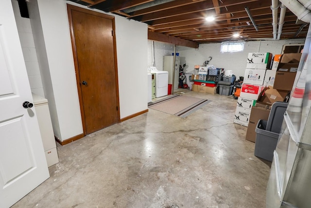 216 E 9th St, Pella, IA 50219 - below grade area with washer / dryer and baseboards