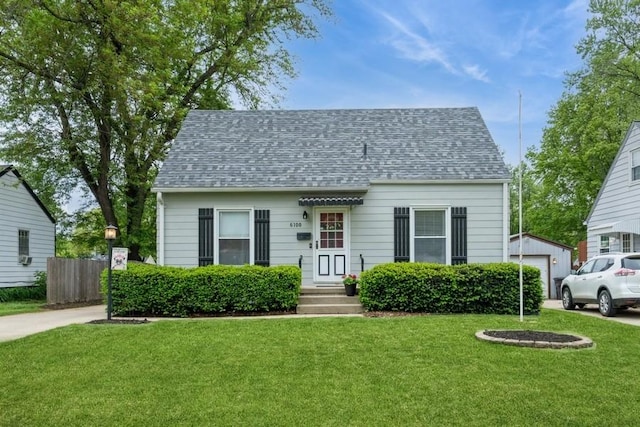 6100 College Ave, Des Moines, IA 50322 - view of front of home featuring a shingled roof and a garage