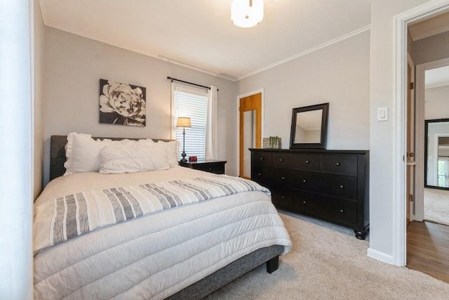 6100 College Ave, Des Moines, IA 50322 - bedroom with light carpet, crown molding, and baseboards