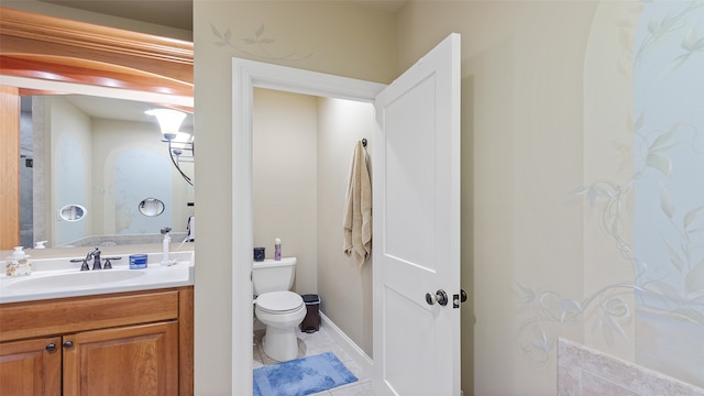 510 Lexington Dr, Clear Lake, IA 50428 - bathroom featuring toilet, vanity, and tile patterned floors