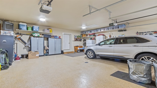 510 Lexington Dr, Clear Lake, IA 50428 - garage featuring a garage door opener