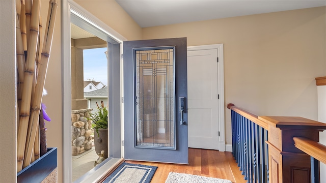 510 Lexington Dr, Clear Lake, IA 50428 - doorway to outside featuring wood finished floors