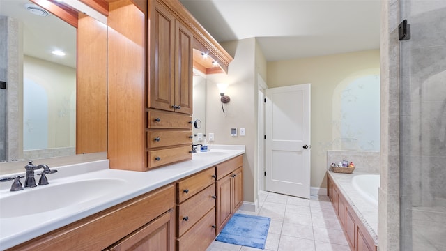 510 Lexington Dr, Clear Lake, IA 50428 - full bathroom with double vanity, tile patterned flooring, and a garden tub
