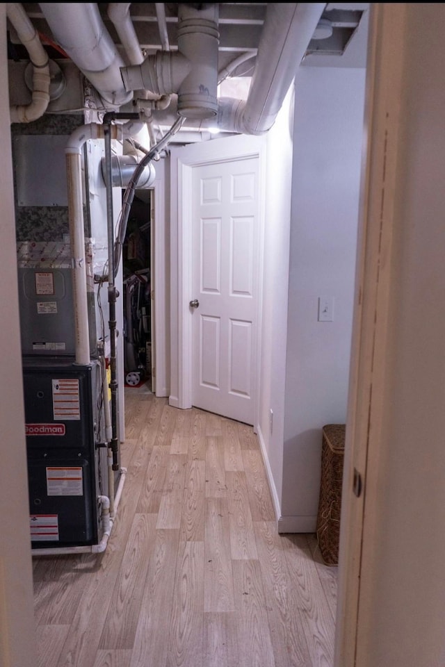2326 E 39th Ct, Des Moines, IA 50317 - below grade area with light wood-style floors