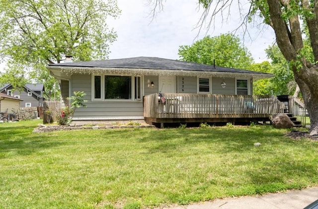 2326 E 39th Ct, Des Moines, IA 50317 - view of front of property featuring a front yard, a wooden deck, and a chimney
