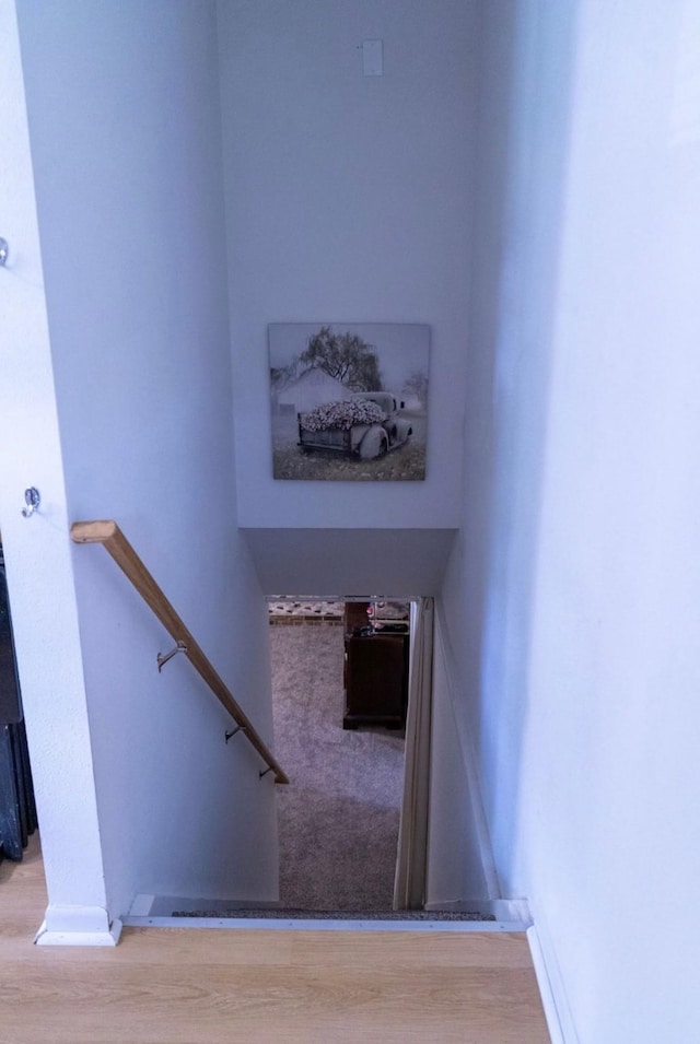 2326 E 39th Ct, Des Moines, IA 50317 - staircase with wood finished floors and baseboards