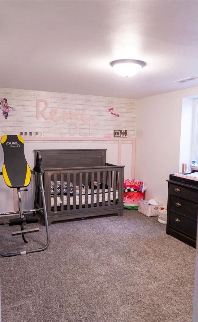 2326 E 39th Ct, Des Moines, IA 50317 - carpeted bedroom with a nursery area