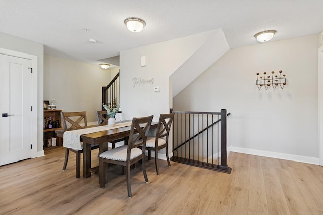 247 Red Oak Ct, Norwalk, IA 50211 - dining area with light wood-style flooring and baseboards