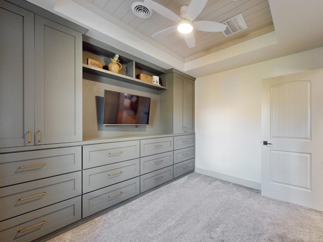 1314 Glenway Dr, Newton, IA 50208 - unfurnished bedroom with light colored carpet, a tray ceiling, baseboards, wood ceiling, and a ceiling fan