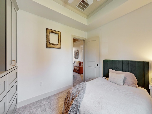 1314 Glenway Dr, Newton, IA 50208 - bedroom featuring carpet, a tray ceiling, and baseboards