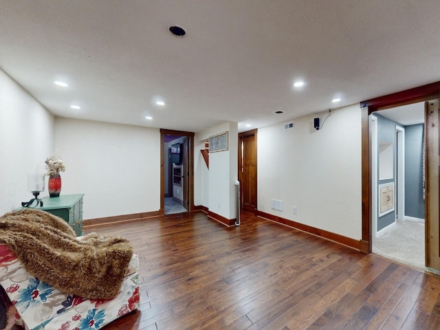 1314 Glenway Dr, Newton, IA 50208 - living area with dark wood finished floors, recessed lighting, and baseboards