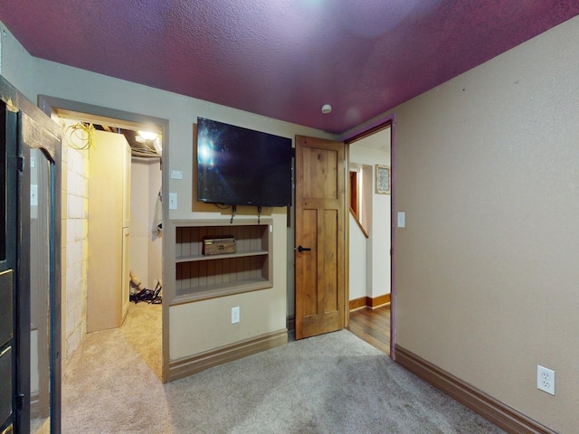 1314 Glenway Dr, Newton, IA 50208 - unfurnished bedroom featuring carpet flooring, baseboards, and a textured ceiling