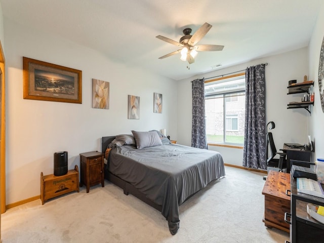 528 Kelsey Ln, Altoona, IA 50009 - bedroom with light carpet, baseboards, and ceiling fan