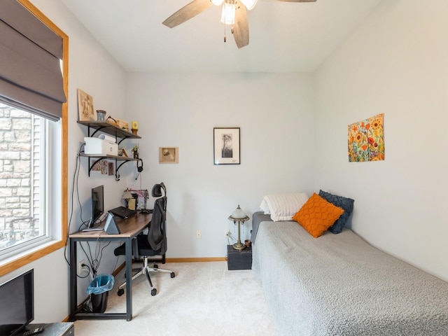 528 Kelsey Ln, Altoona, IA 50009 - carpeted bedroom featuring a desk, ceiling fan, and baseboards