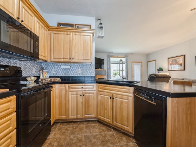 528 Kelsey Ln, Altoona, IA 50009 - kitchen with black appliances, a sink, a peninsula, tasteful backsplash, and light brown cabinets