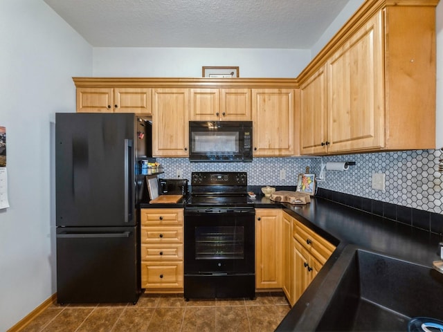 528 Kelsey Ln, Altoona, IA 50009 - kitchen featuring black appliances, dark countertops, decorative backsplash, dark tile patterned flooring, and a sink